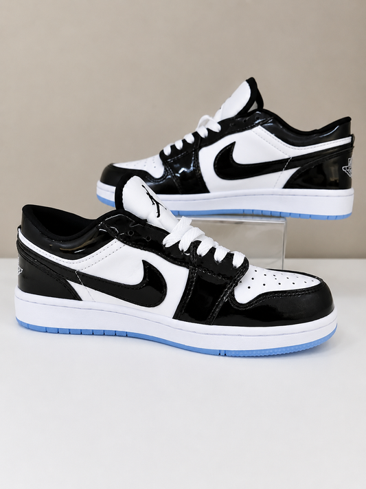Zapatos sneakers que combinan el clásico contraste blanco y negro